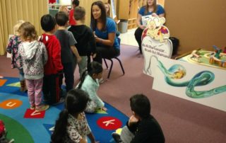 Dr. Provo teaching tooth brushing to preschoolers