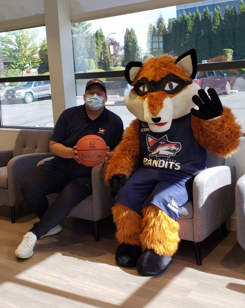Berry The Bandit sitting in NOVO Dental Centre's reception area